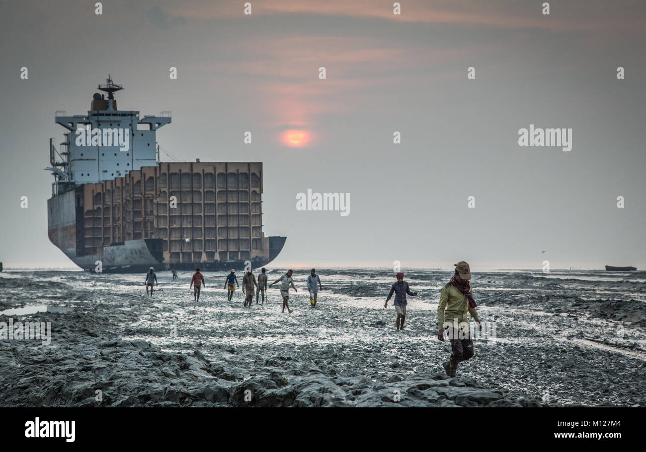 workers leaving after a days labor at a ship braking yard in Chittagong, Bangladesh Stock Photo