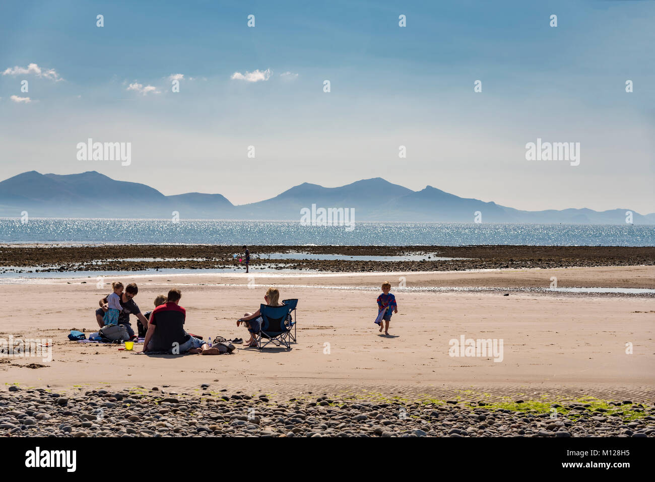 Family on beach Llanddwyn Island (Ynys Llanddwyn). Anglesey North Wales. Stock Photo