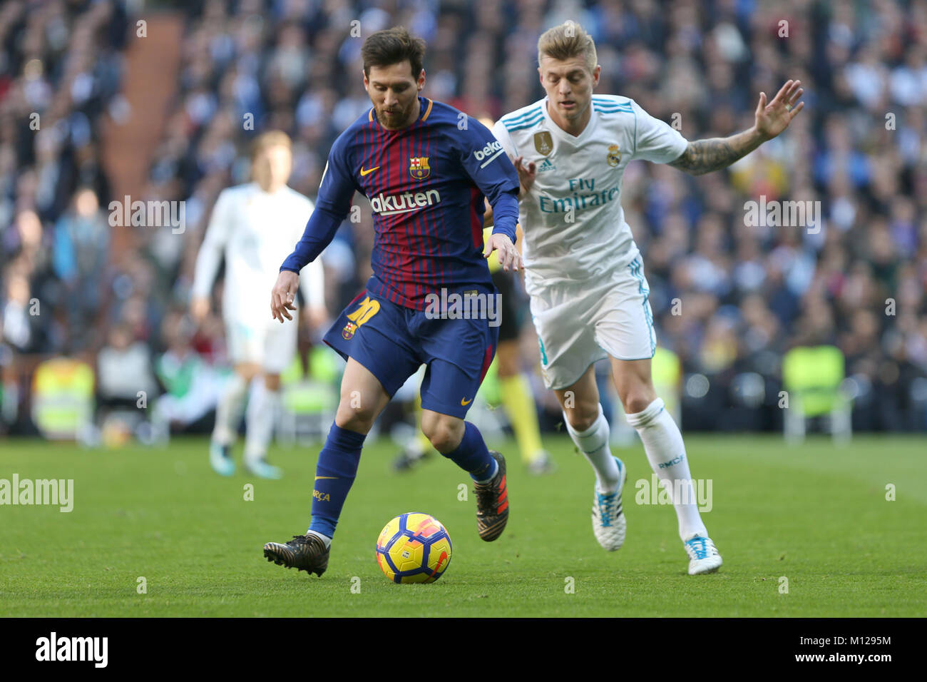 MADRID, SPAIN. December 23, 2017 - Lionel Messi withe the ball and Toni Kroos. Real Madrid failed to close out the year by claiming victory in El Clas Stock Photo