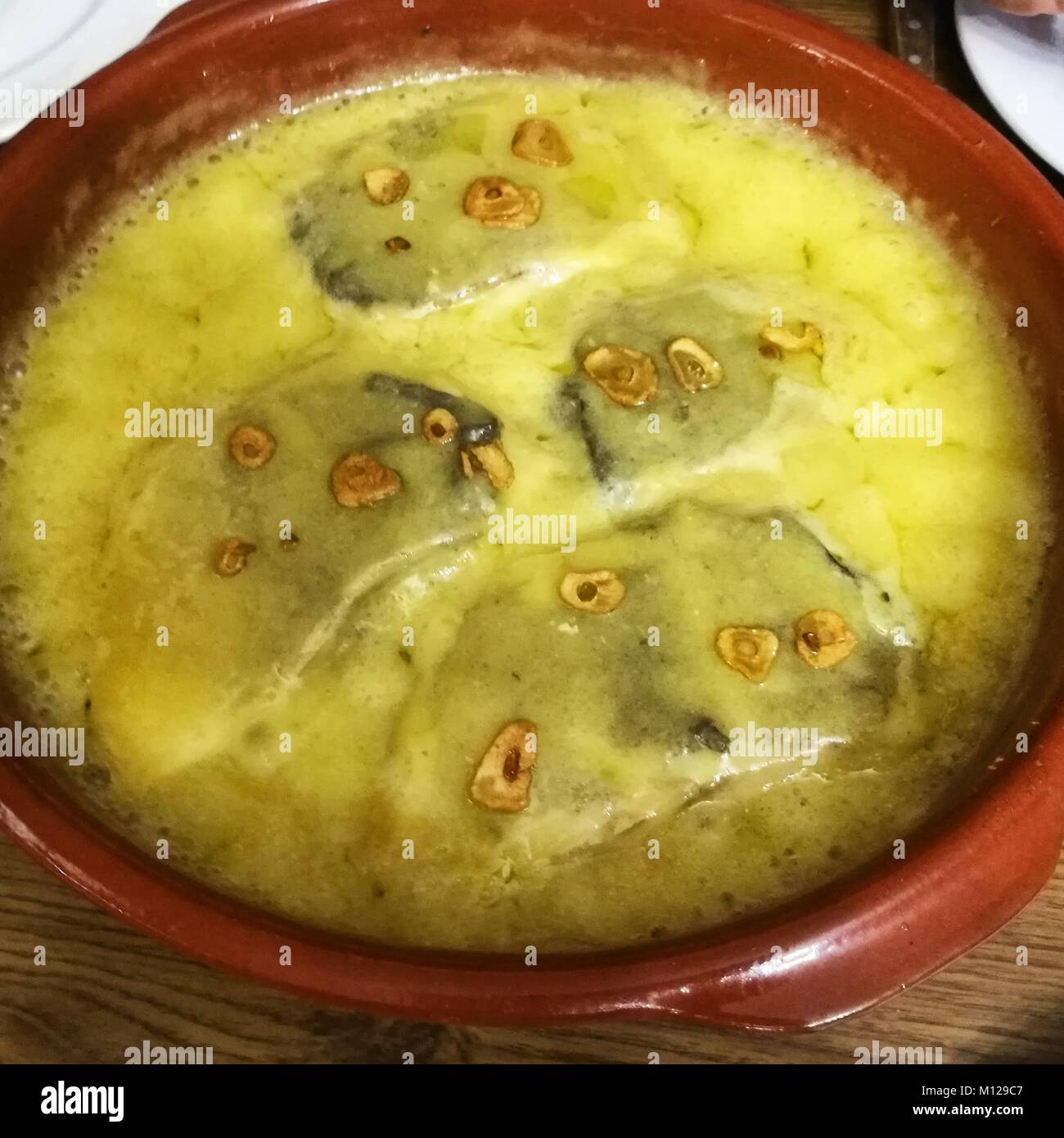 Salt cod in a pilpil sauce a typical Basque recipe Stock Photo Alamy