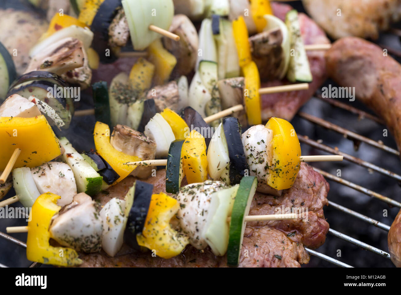 barbecue with delicious grilled meat and vegetables on grill Stock ...
