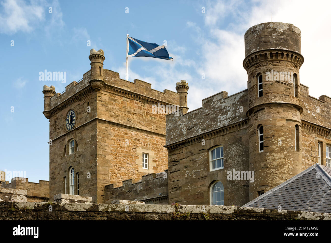 Towers of Calzean castle with Scottish flag waving in the breeze, Scotland, UK Stock Photo