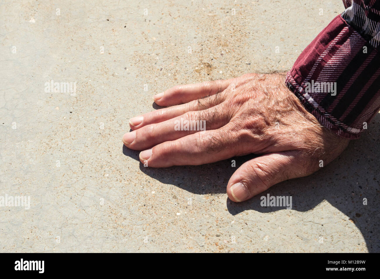 Detail of old man's hand on a sunny day. Stock Photo