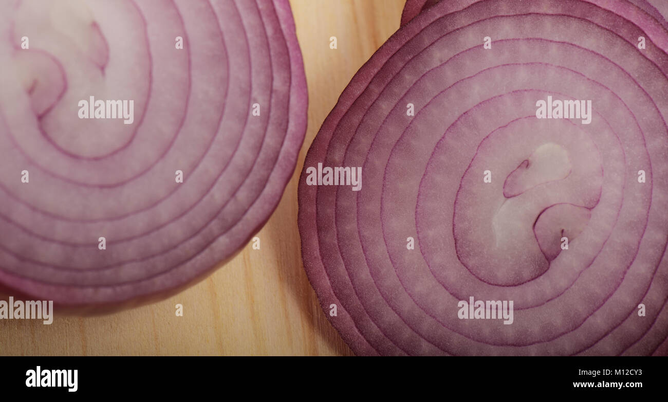 Close-up, detail, food, sliced red onion, wood cutting board, circles, still life, cooking, ring Stock Photo