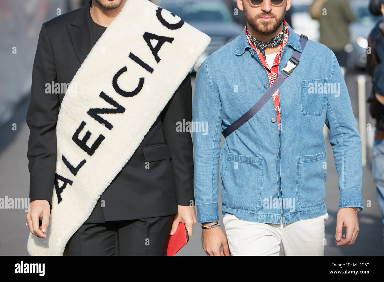 MILAN - JANUARY 14: Two men with white Balenciaga scarf and blue jeans  shirt before Dsquared 2 fashion show, Milan Fashion Week street style on  Januar Stock Photo - Alamy