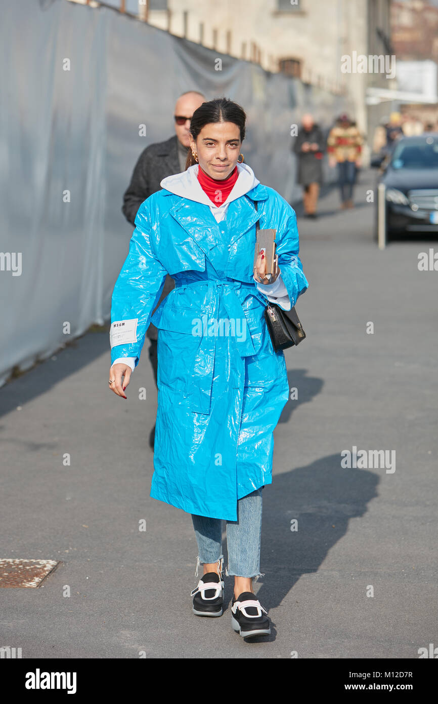 MILAN - JANUARY 14: Woman with light blue trench coat before Dsquared 2  fashion show, Milan Fashion Week street style on January 14, 2018 in Milan  Stock Photo - Alamy