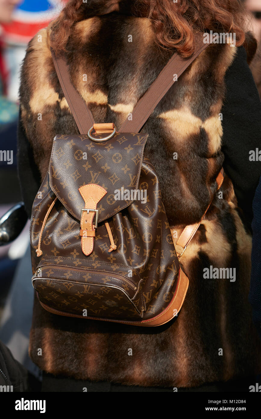 MILAN - SEPTEMBER 23: Woman with black Louis Vuitton bag with pink flames  before Antonio Marras fashion show, Milan Fashion Week street style on  Septe Stock Photo - Alamy