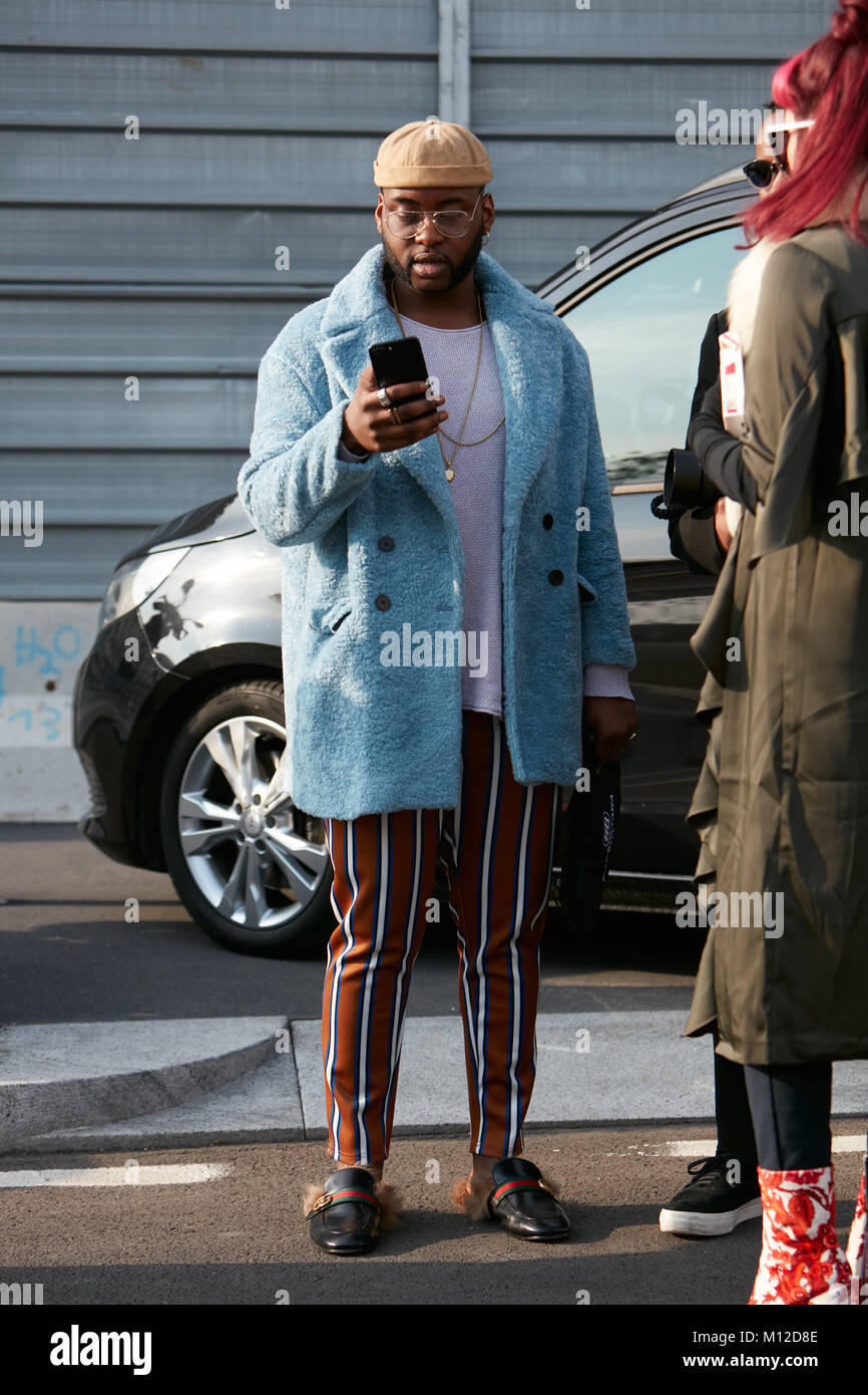 sunlight Say aside Ours MILAN - JANUARY 14: Man with blue coat, striped trousers and Gucci shoes  before Dsquared 2 fashion show, Milan Fashion Week street style on January  14 Stock Photo - Alamy