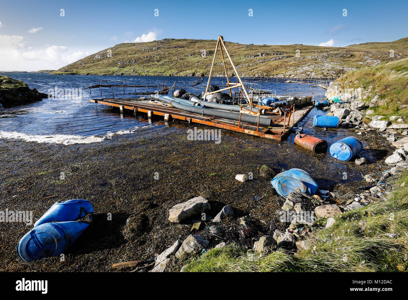 Debris from fish farm industry washed up on shoreline in Shetland Stock Photo