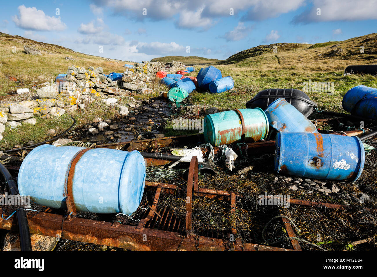 Debris from fish farm industry washed up on shoreline in Shetland Stock Photo
