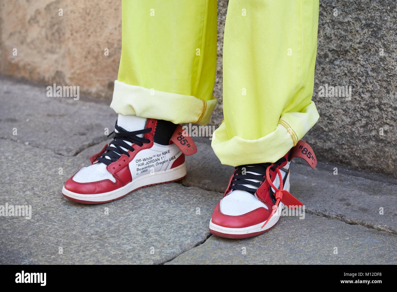 MILAN - JANUARY 14: Man with white and red Nike Air Jordan sneakers and  yellow jeans before MSGM fashion show, Milan Fashion Week street style on  Janu Stock Photo - Alamy