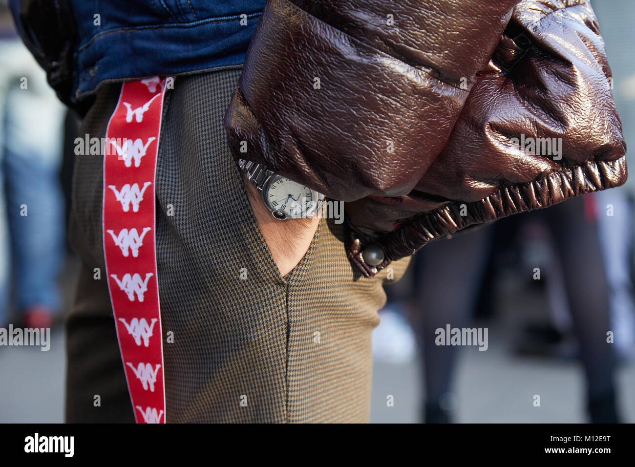 MILAN - JANUARY 14: Man with Cartier Ballon Bleu watch and red Kappa belt  before Daks fashion show, Milan Fashion Week street style on January 14,  201 Stock Photo - Alamy