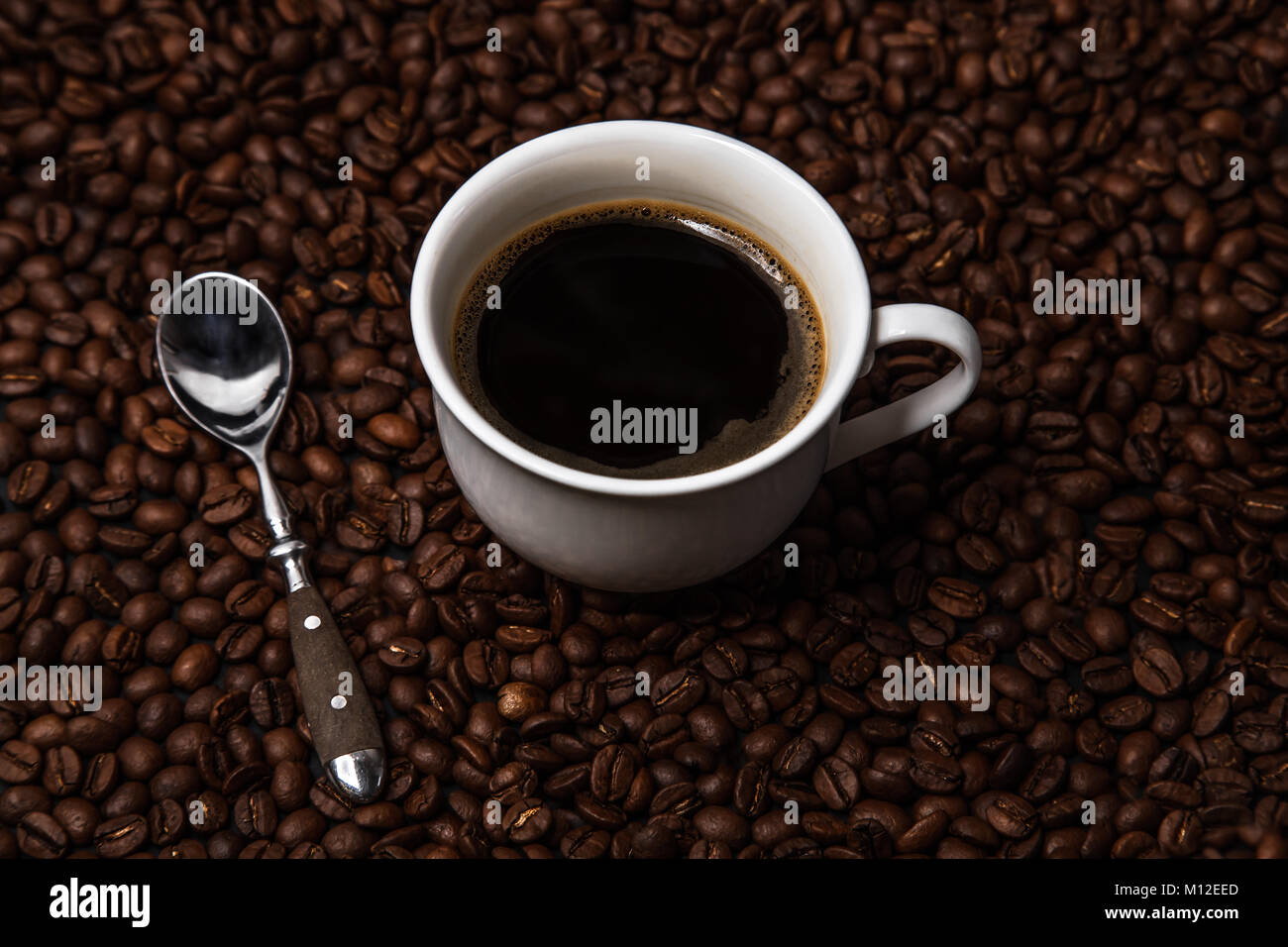 cup of coffee on coffee beans Stock Photo
