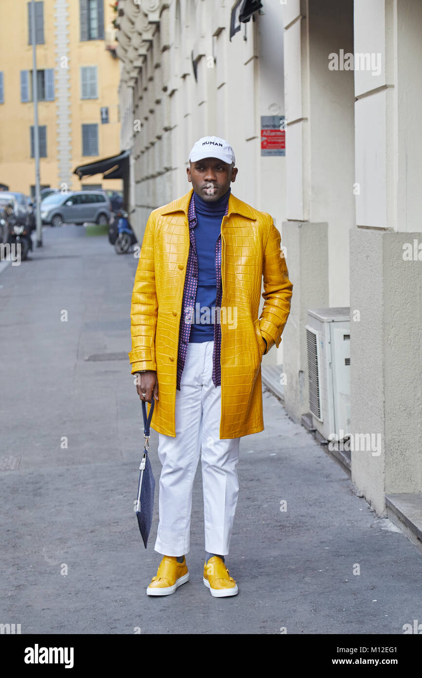 MILAN - JANUARY 14: Man with golden bomber jacket looking at smartphone  before Daks fashion show, Milan Fashion Week street style on January 14,  2018 Stock Photo - Alamy