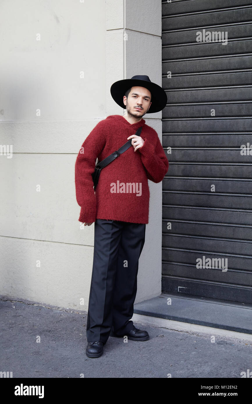 MILAN - JANUARY 14: Man with dark red sweater and black hat before Daks  fashion show, Milan Fashion Week street style on January 14, 2018 in Milan  Stock Photo - Alamy