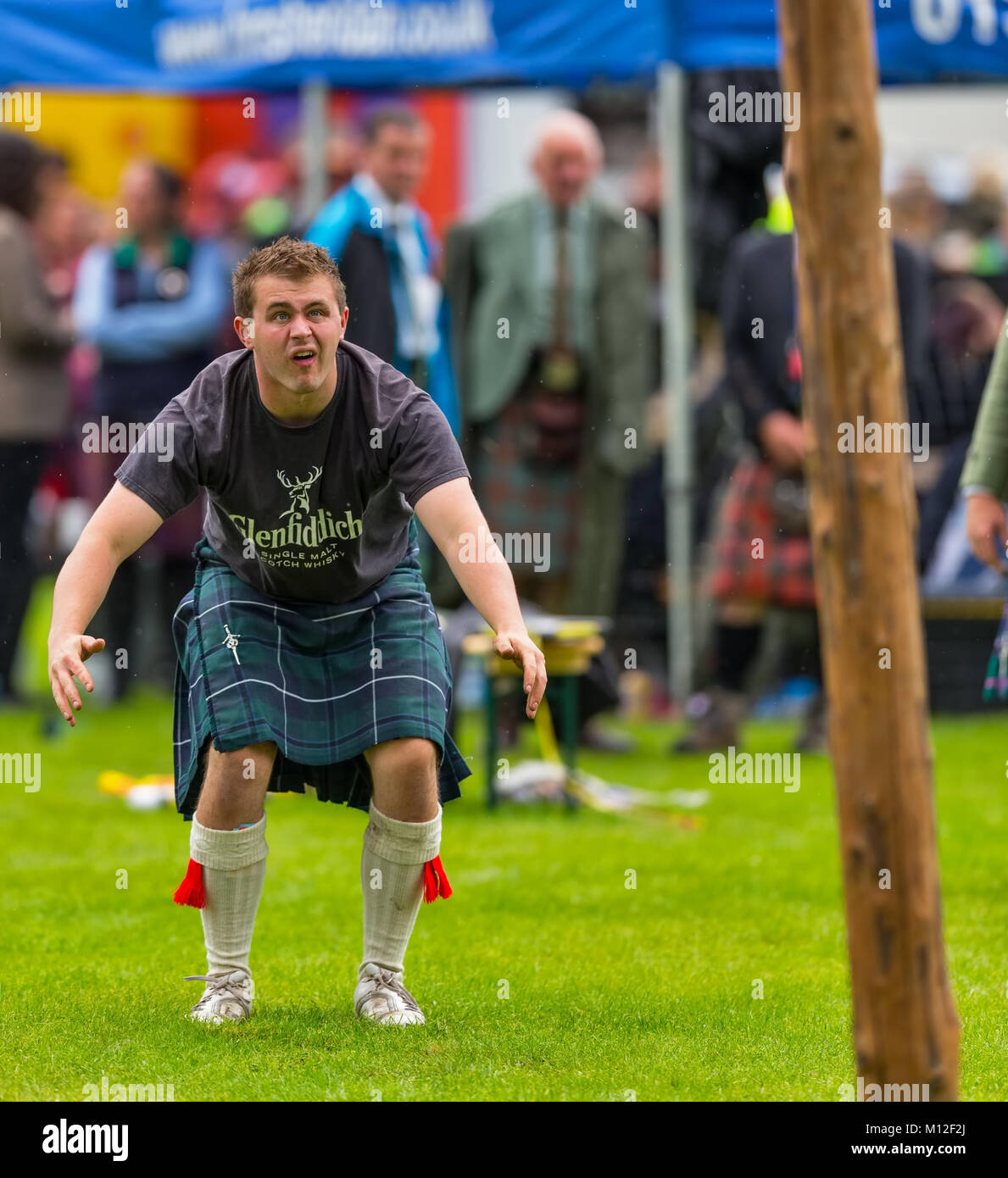 Jamie Dawkins from Aboyne with the Caber. Stock Photo