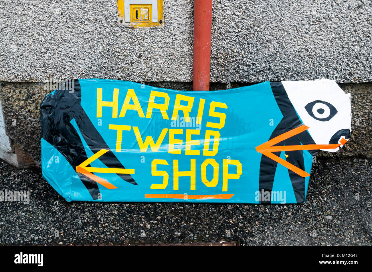 Homemade sign for a Harris Tweed shop in Stornoway on the Isle of Lewis in the Outer Hebrides. Stock Photo