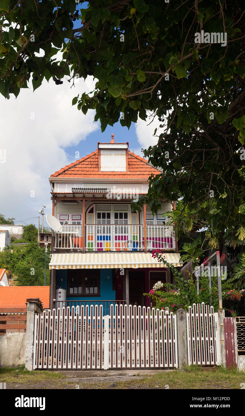 Wooden colored house typical for Caribbean Islands, French West Indies. Stock Photo