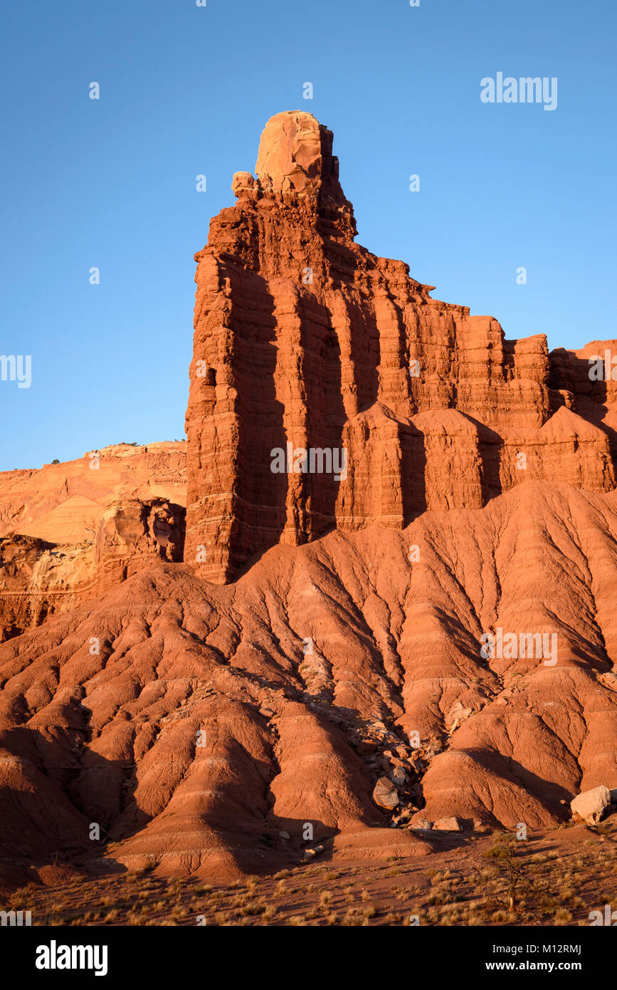 Chimney Rock, a dark red Moenkopi formation capped with white Shinarump sandstone in Capitol Reef National Park, Utah. Stock Photo