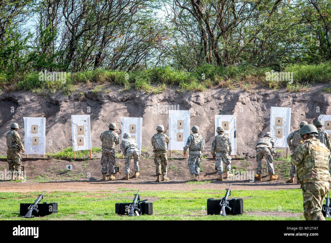 Soldiers of 103rd Troop Command observe their targets down range while conducting their individual weapon qualification November 3, 2017 at Pu’uloa range, Hawaii. Stock Photo
