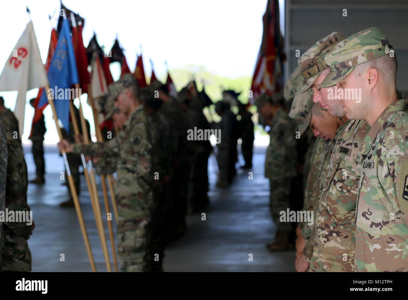 Soldiers of the 29th Infantry Brigade Combat Team bow their heads ...