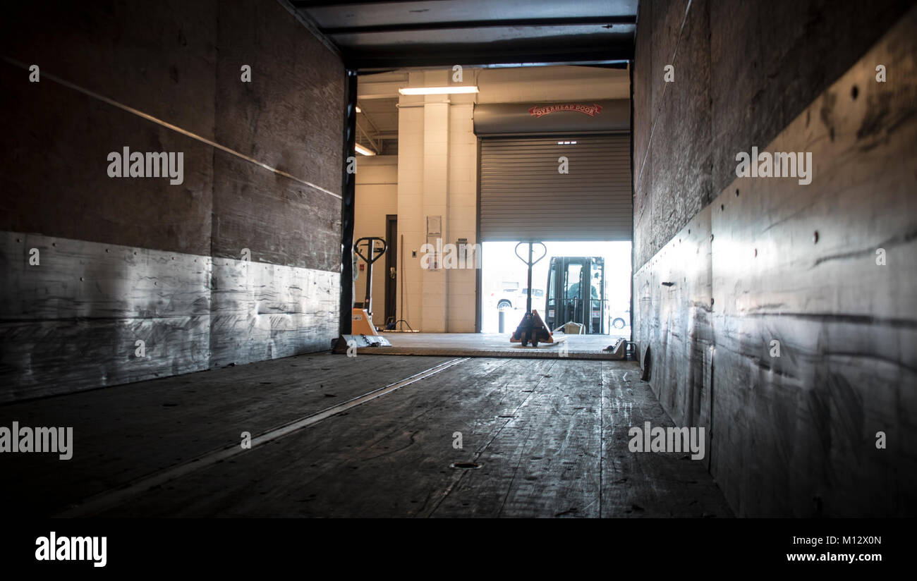 Airmen from the 179th Airlift Wing safely transfer munitions from the ...