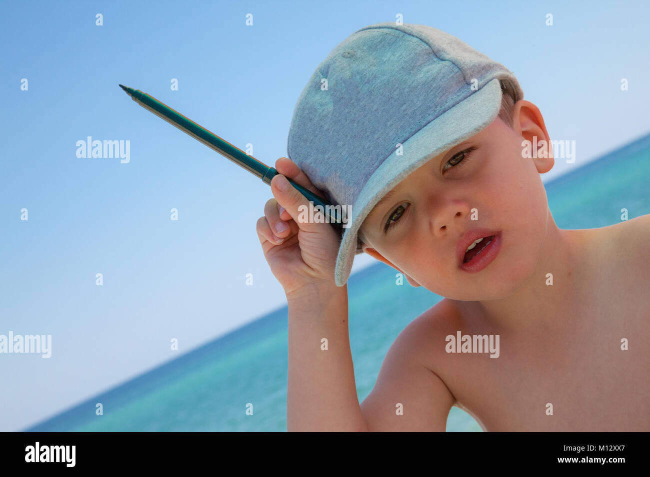 Young Boy Pen Sea Stock Photo