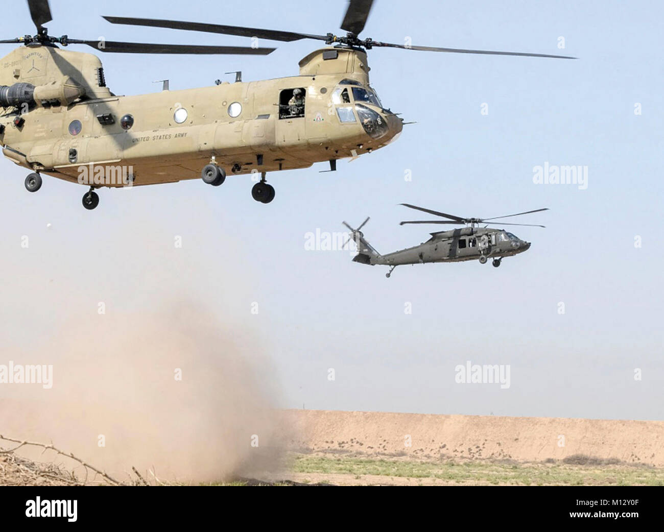 A UH60M Black Hawk helicopter, right, and a CH47 Chinook helicopter