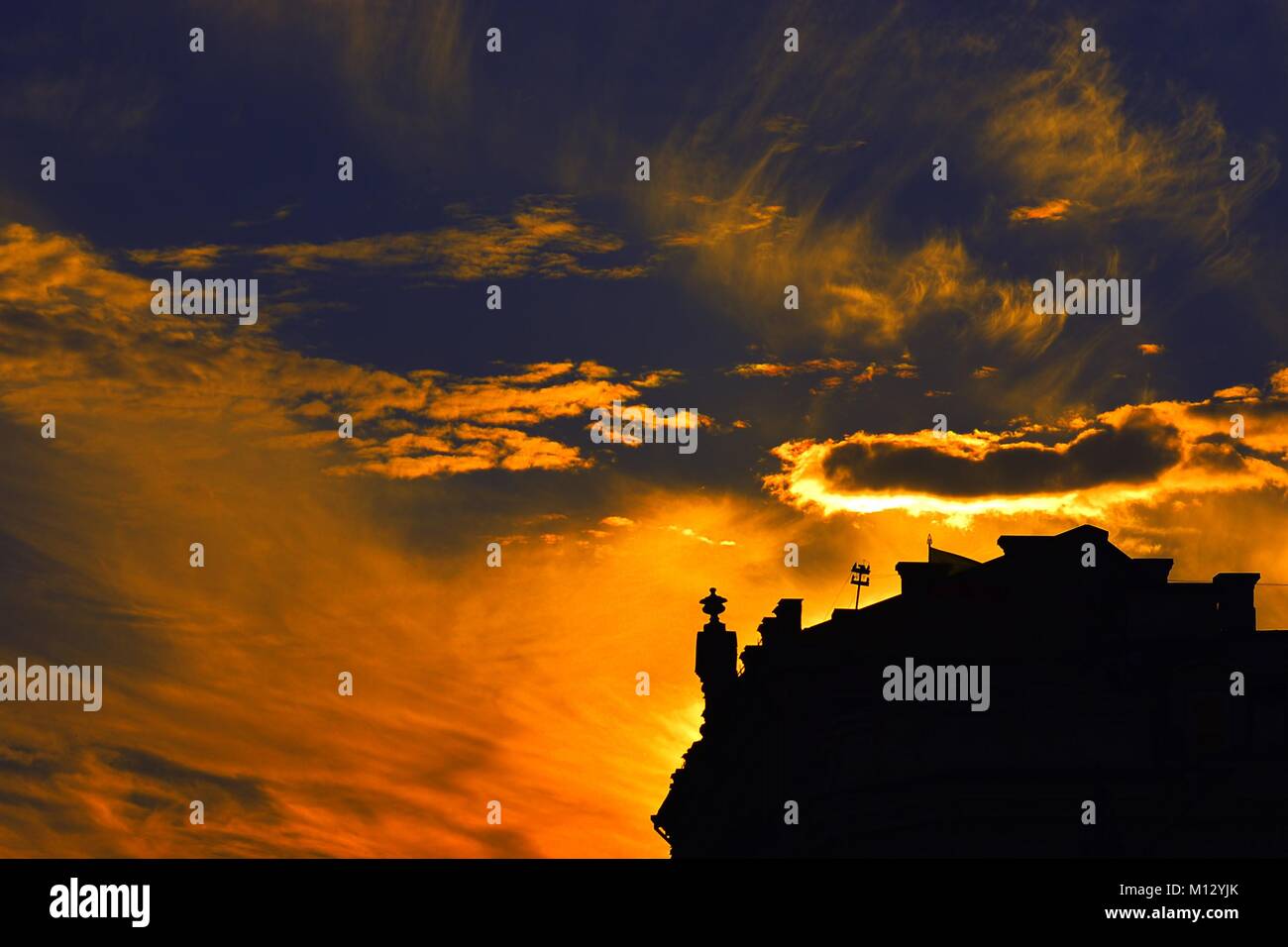 A silhouette of a house during wtilight Stock Photo