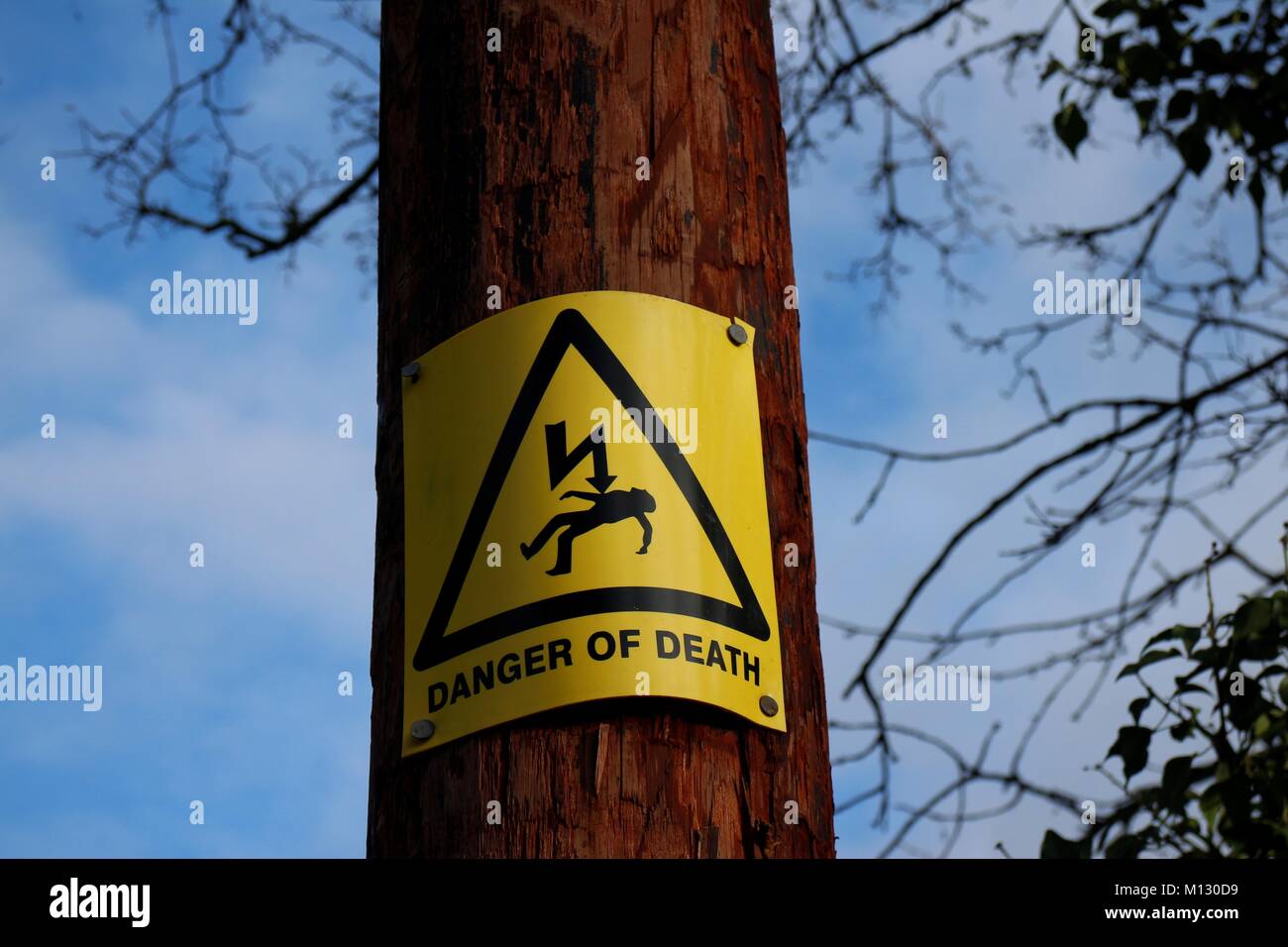 Danger of Death sign on telegraph pole Stock Photo