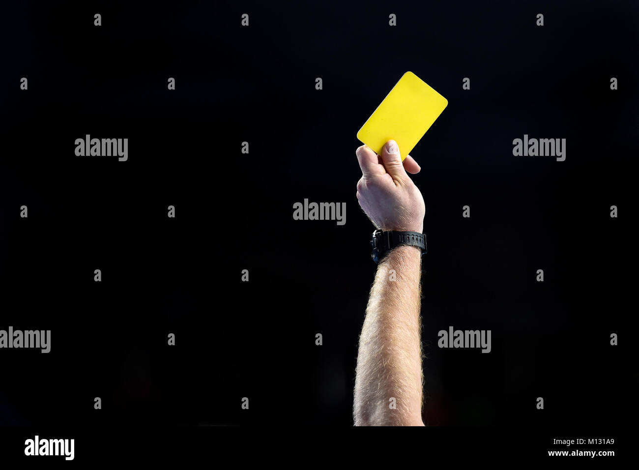 referee hand with yellow card Stock Photo