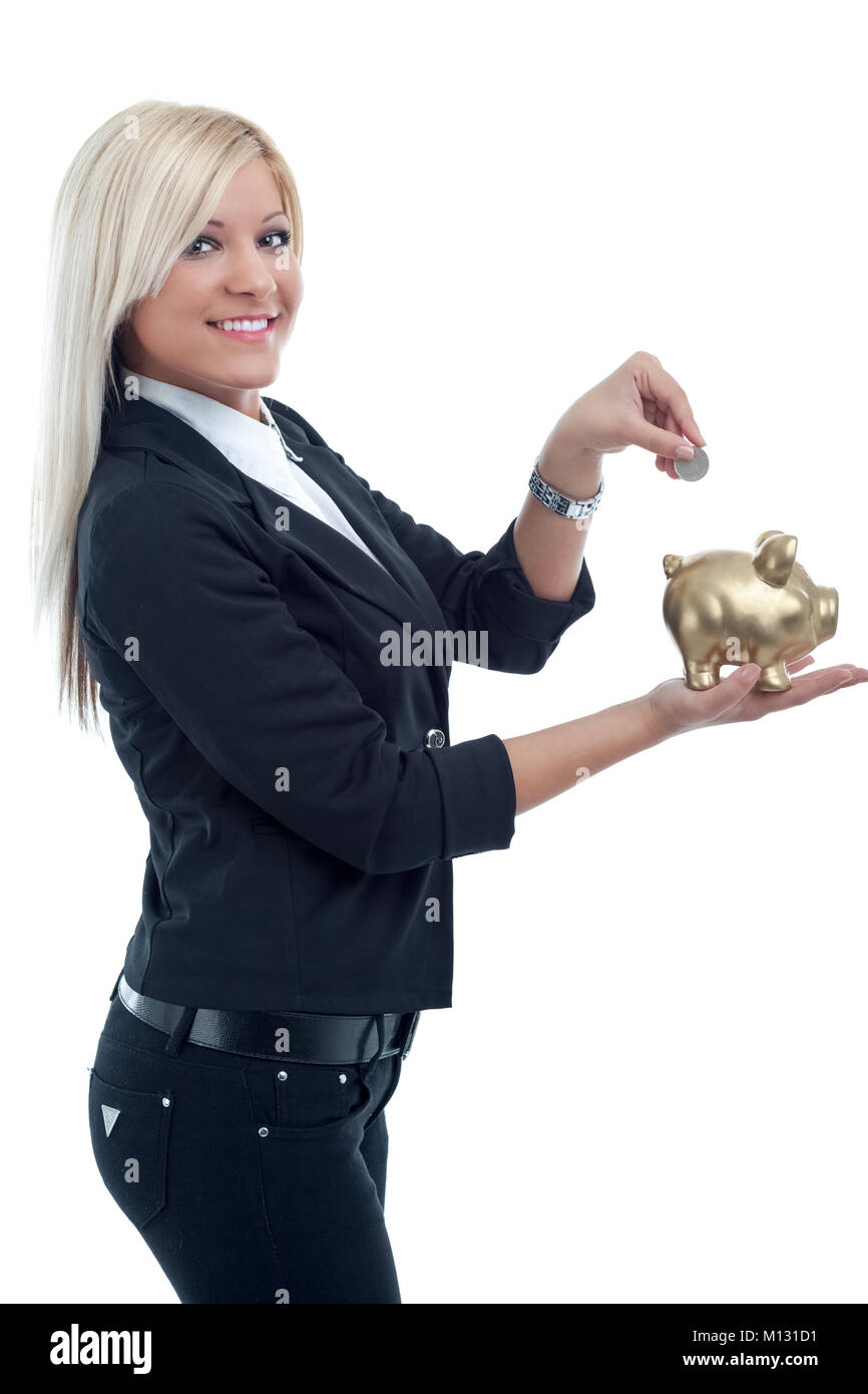 young bussines woman putting a coin into a big piggy bank Stock Photo ...