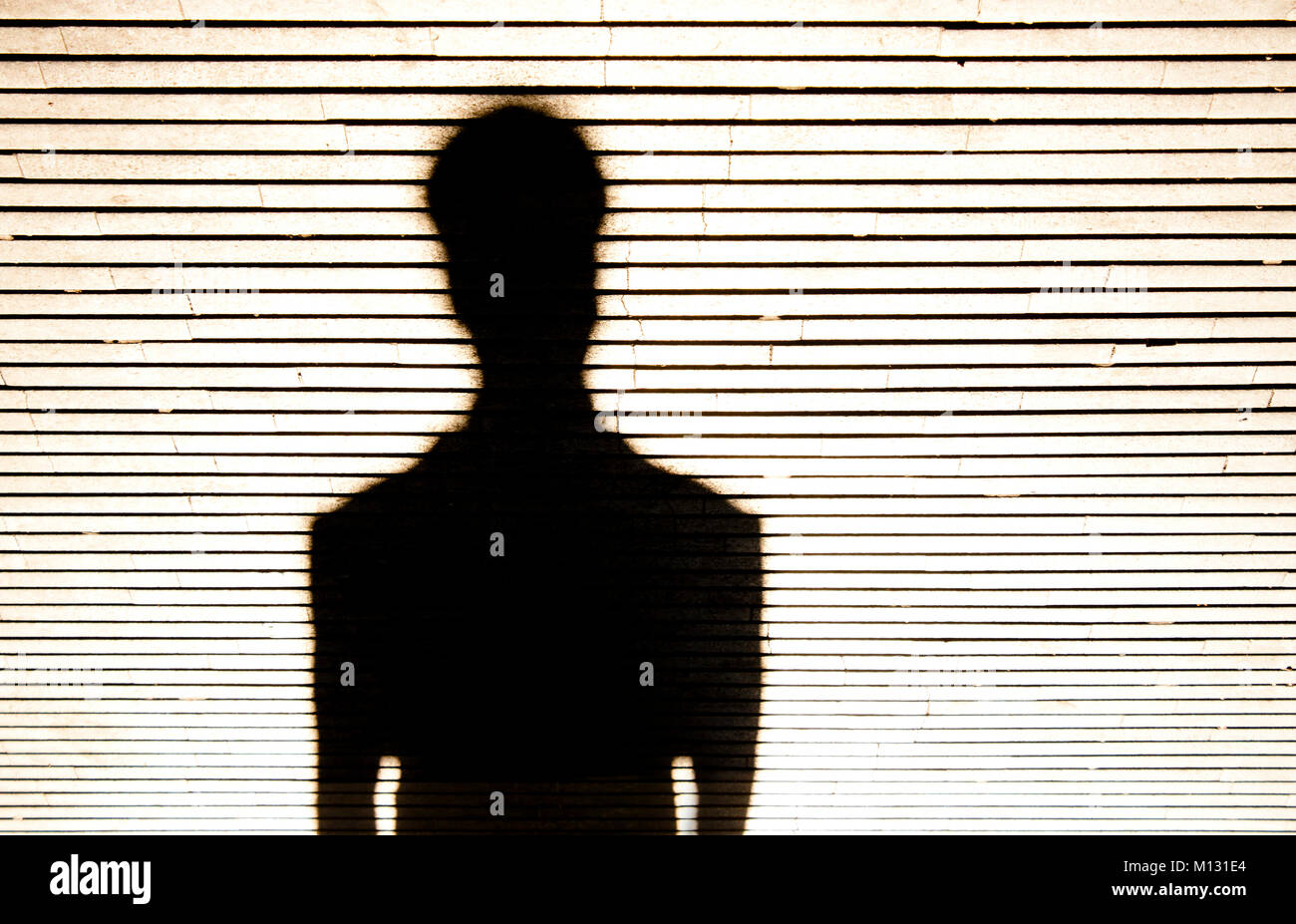 Anonymous person portrait silhouette in black and white on patterned background Stock Photo