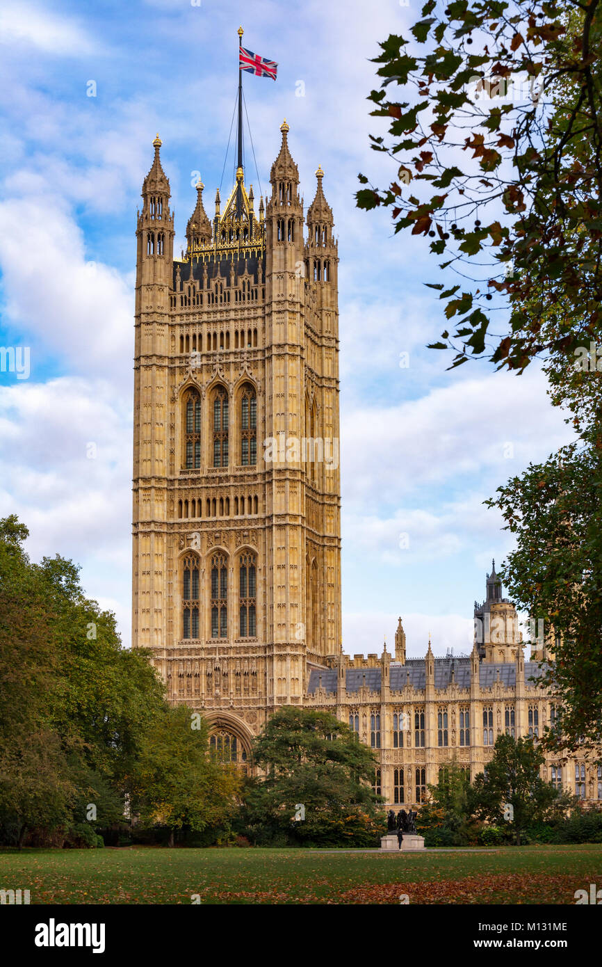 The Victoria Tower at the south-west end of the Palace of Westminster as viewed from the Victoria Tower Gardens public park, City of Westminster, Cent Stock Photo