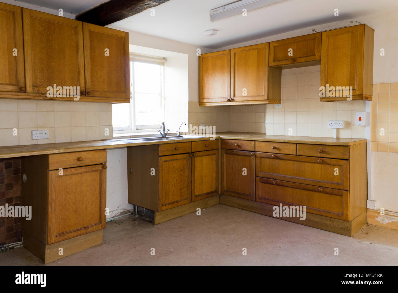 An empty kitchen in a vacant house Stock Photo
