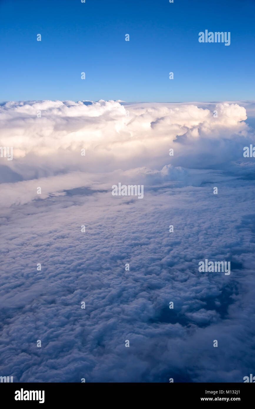 View of the sky and clouds from the airplane porthole Stock Photo