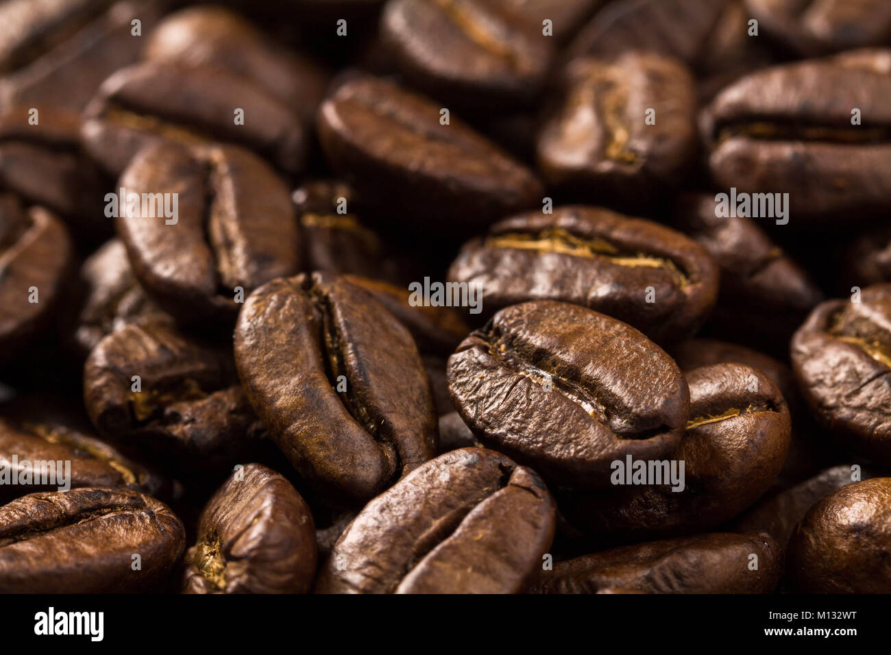 roasted brown coffee beans background Stock Photo - Alamy