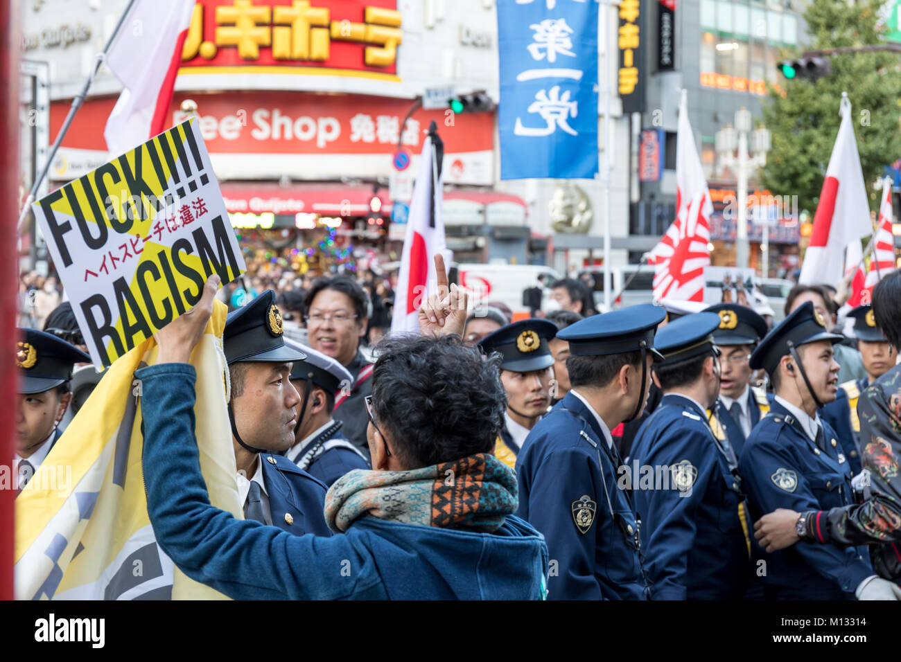 Protest against Japanese nationalists marching through Shinjuku; Tokyo, Japan Stock Photo