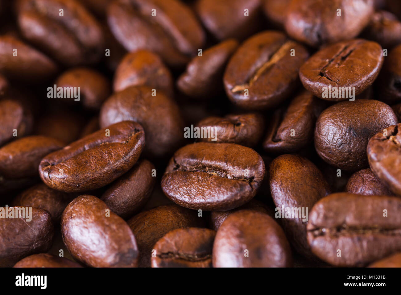 roasted brown coffee beans background Stock Photo - Alamy