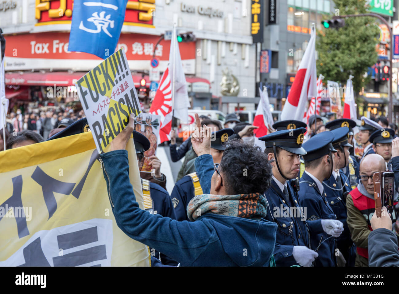 Protest against Japanese nationalists marching through Shinjuku; Tokyo, Japan Stock Photo