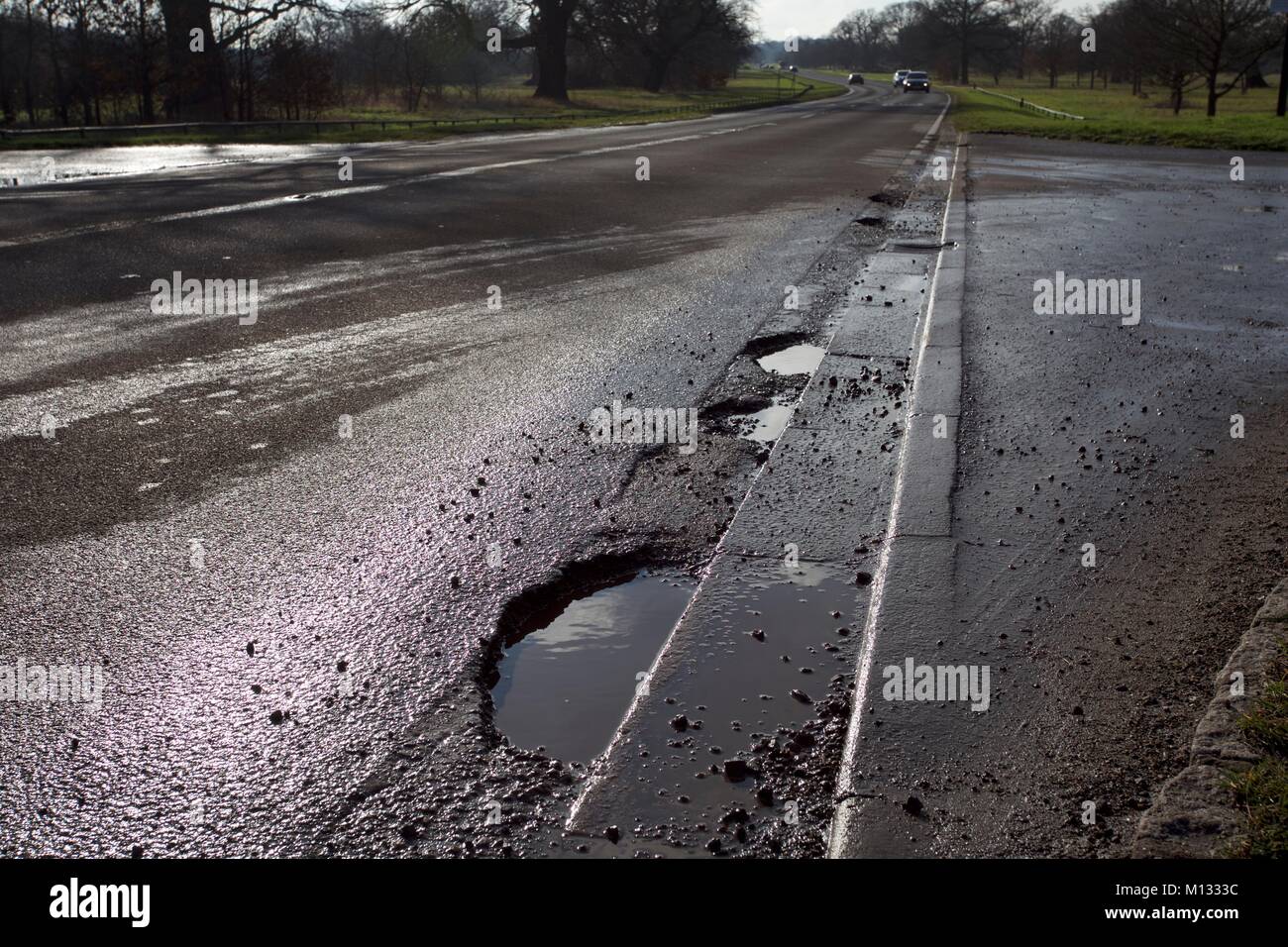 Multiple potholes in road hires stock photography and images Alamy