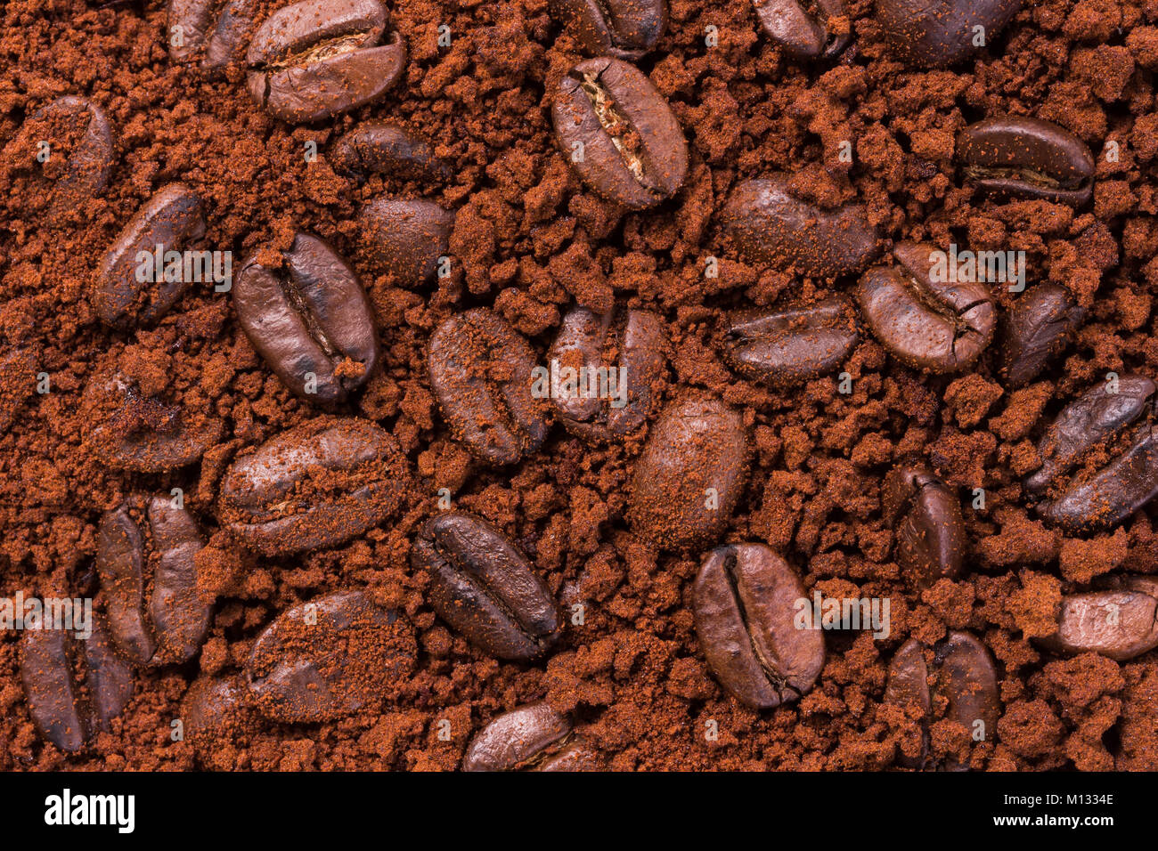 roasted brown coffee beans and powder background Stock Photo - Alamy