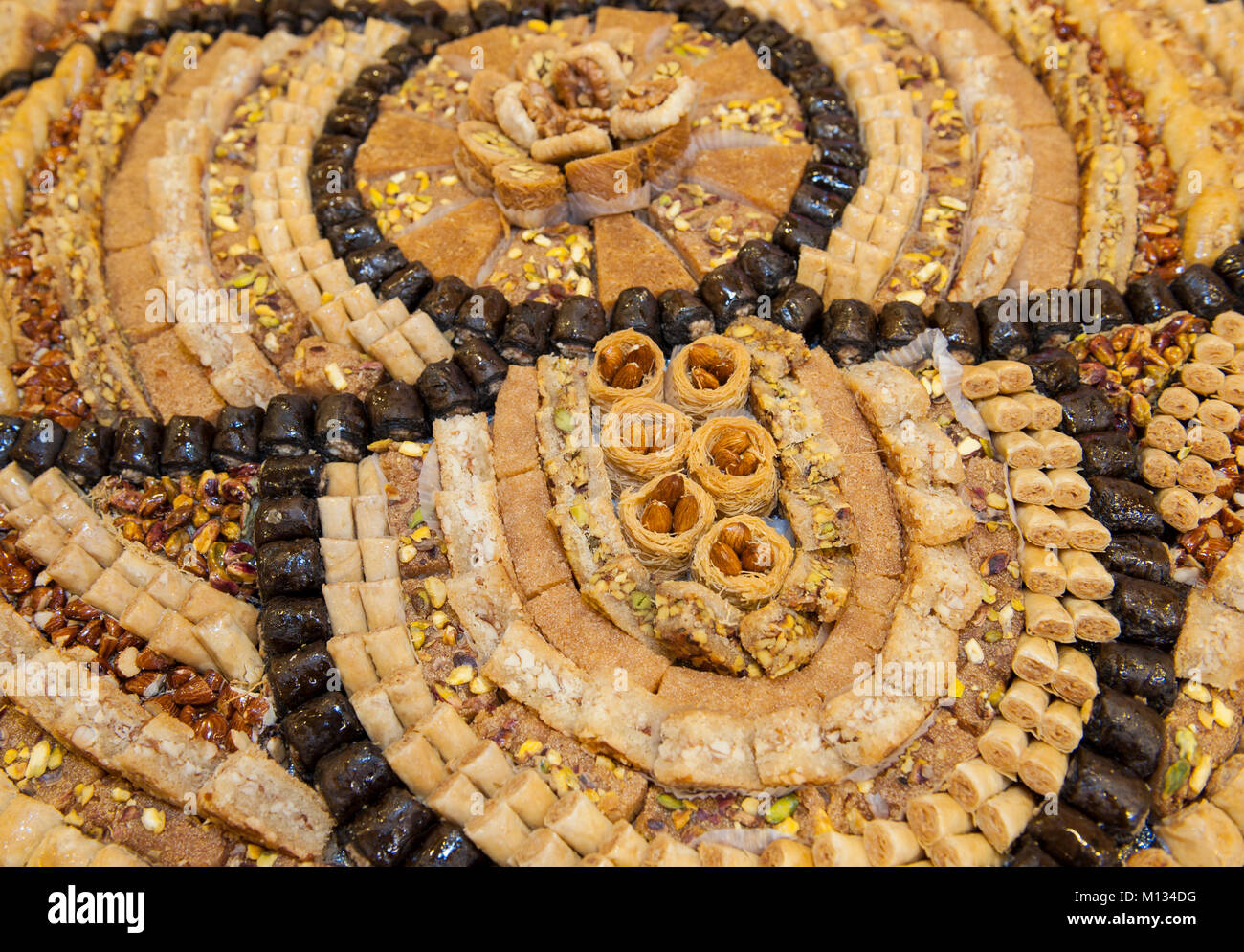 Selection display of sweet oriental pastry petit four food with baklava at a luxury restaurant buffet bar area Stock Photo