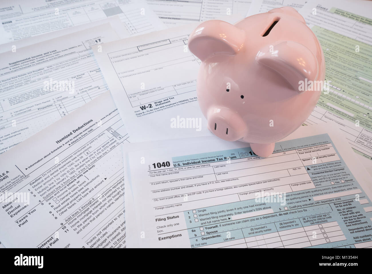 IRS Federal Tax Forms with Piggy Bank Stock Photo