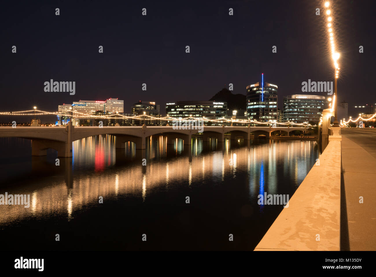 TEMPE, AZ - OCTOBER 25, 2017: The city skyline of Tempe, Arizona at night from across the Salt River at Tempe Town Lake Stock Photo