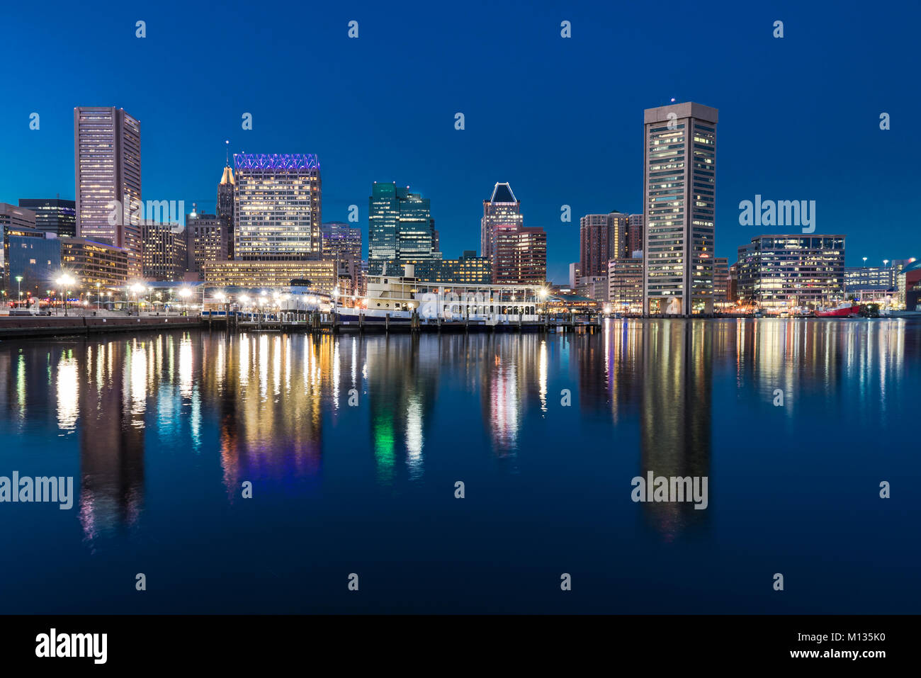 BALTIMORE, MD - DECEMBER 29, 2014: Baltimore night skyline reflection from Inner Harbor Stock Photo