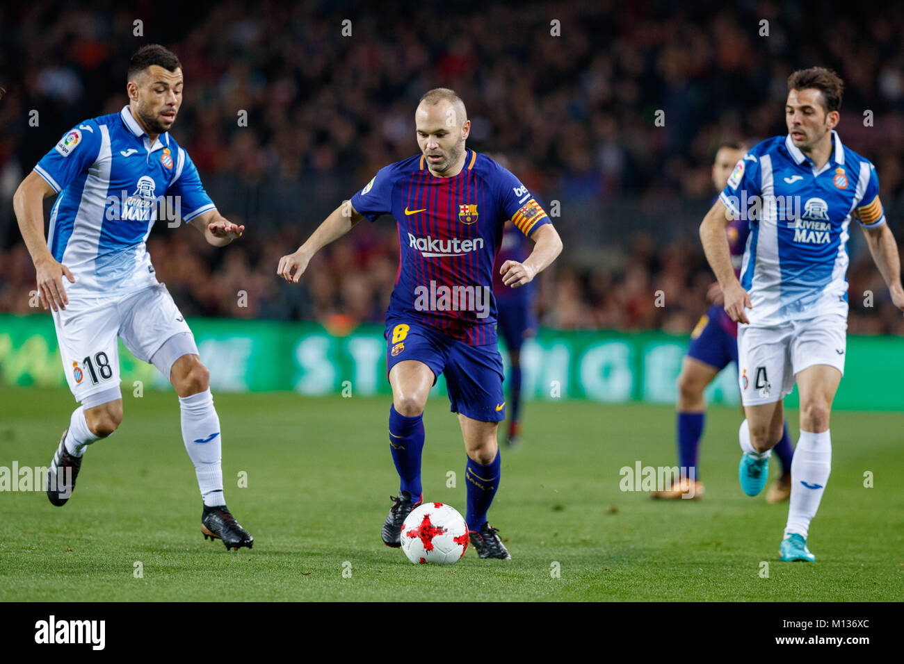 Barcelona, Spain. 25th January, 2018.  Copa del Rey football, quarter final, second leg, Barcelona versus Espanyol; Andres Iniesta Drives the ball forward surrounded by Javi Fuego and Victor Sanchez Credit: UKKO Images/Alamy Live News Stock Photo