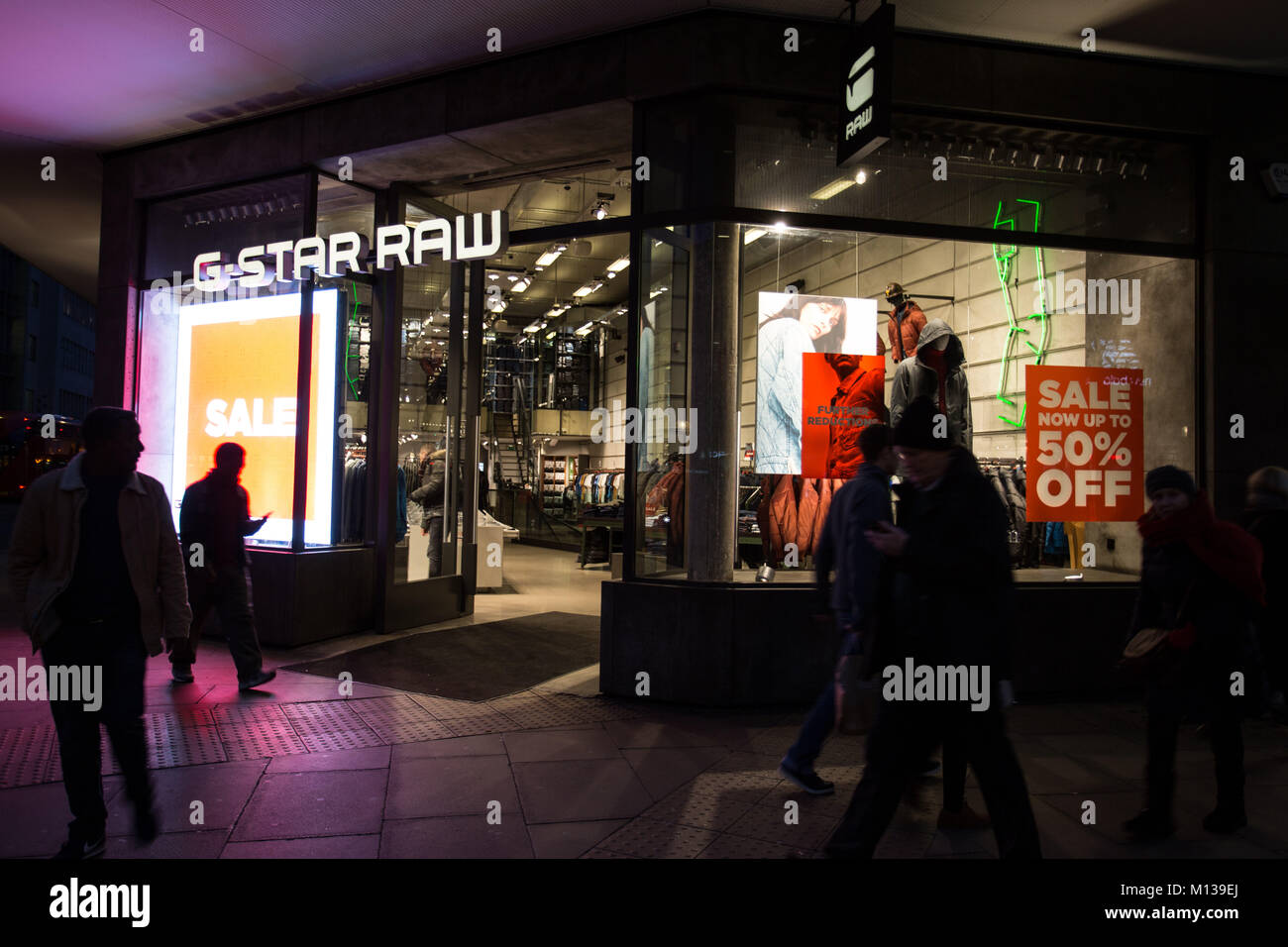 London, UK. 22nd Jan, 2018. People walk past a 'sale' advertisement from an  G-Star RAW Store on Oxford Street in London. Credit: Rahman  Hassani/SOPA/ZUMA Wire/Alamy Live News Stock Photo - Alamy