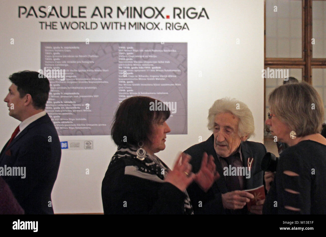 Riga, Estonia. 25th Jan, 2018. The photo historian Peteris Korsaks (2-R ...