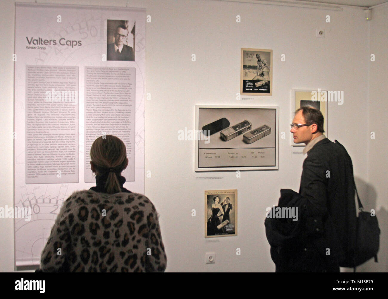 Visitors studying works at the exhibition "The World with Minox" at the ...